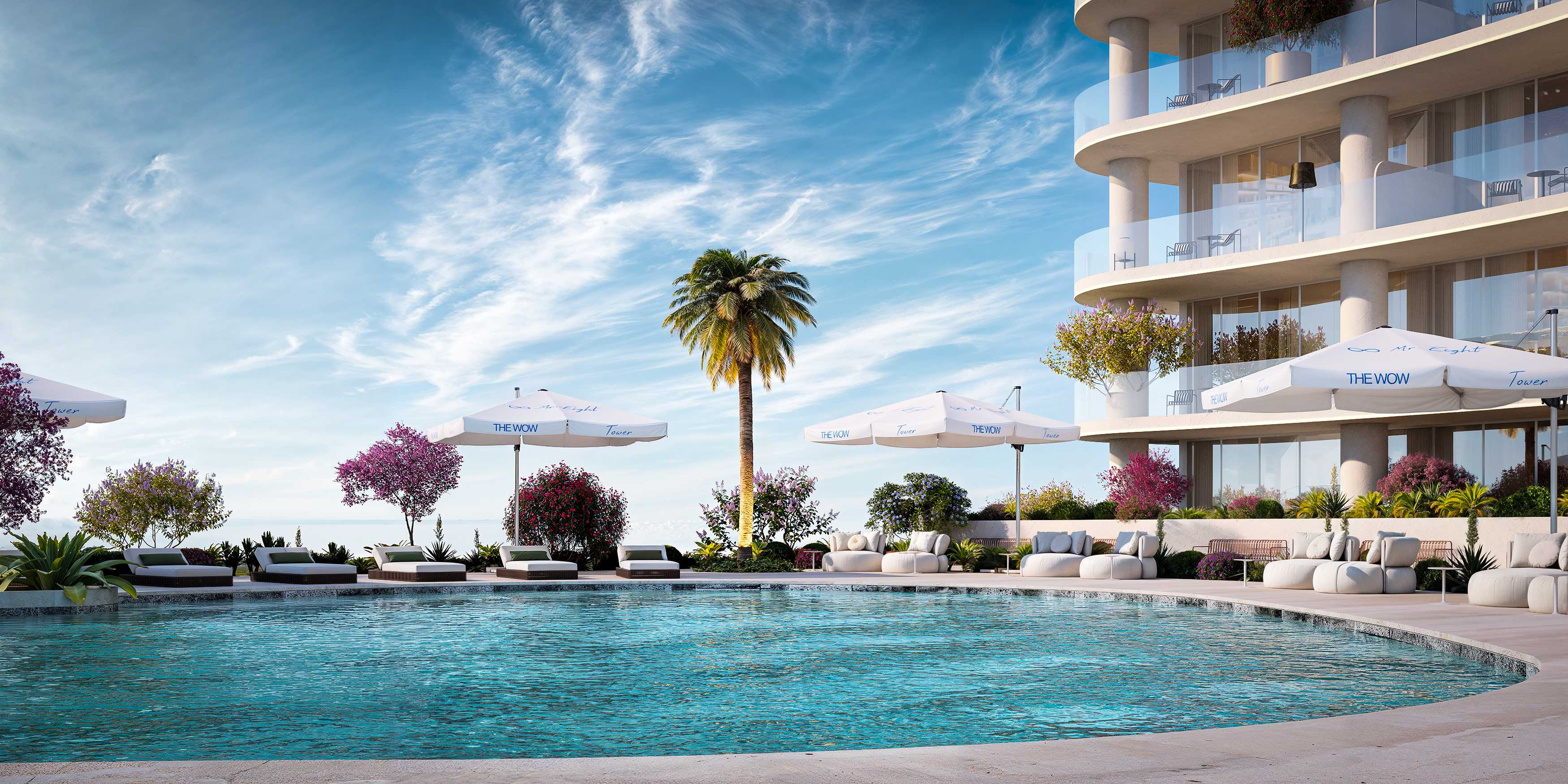 Pool deck with sunbeds, white umbrellas and palm tree under blue sky