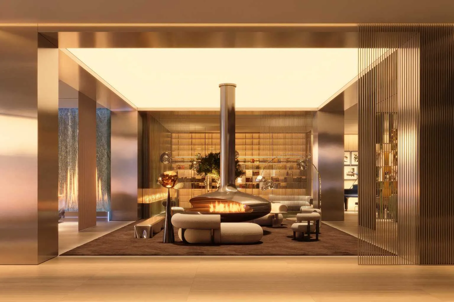 Grand lobby with suspended fireplace, library wall and blue sculptural sofa